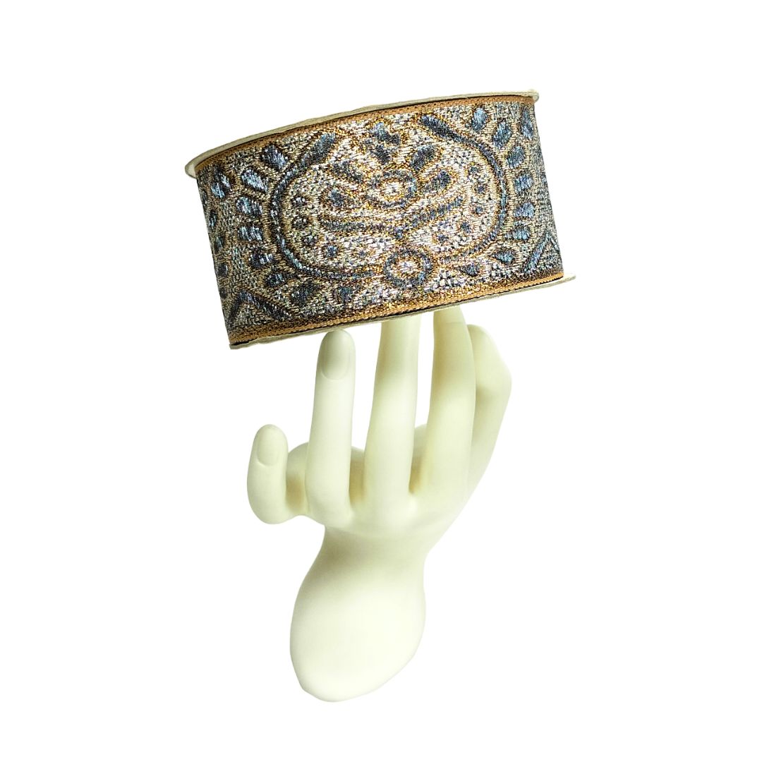 Decorative headband with intricate design on a white background